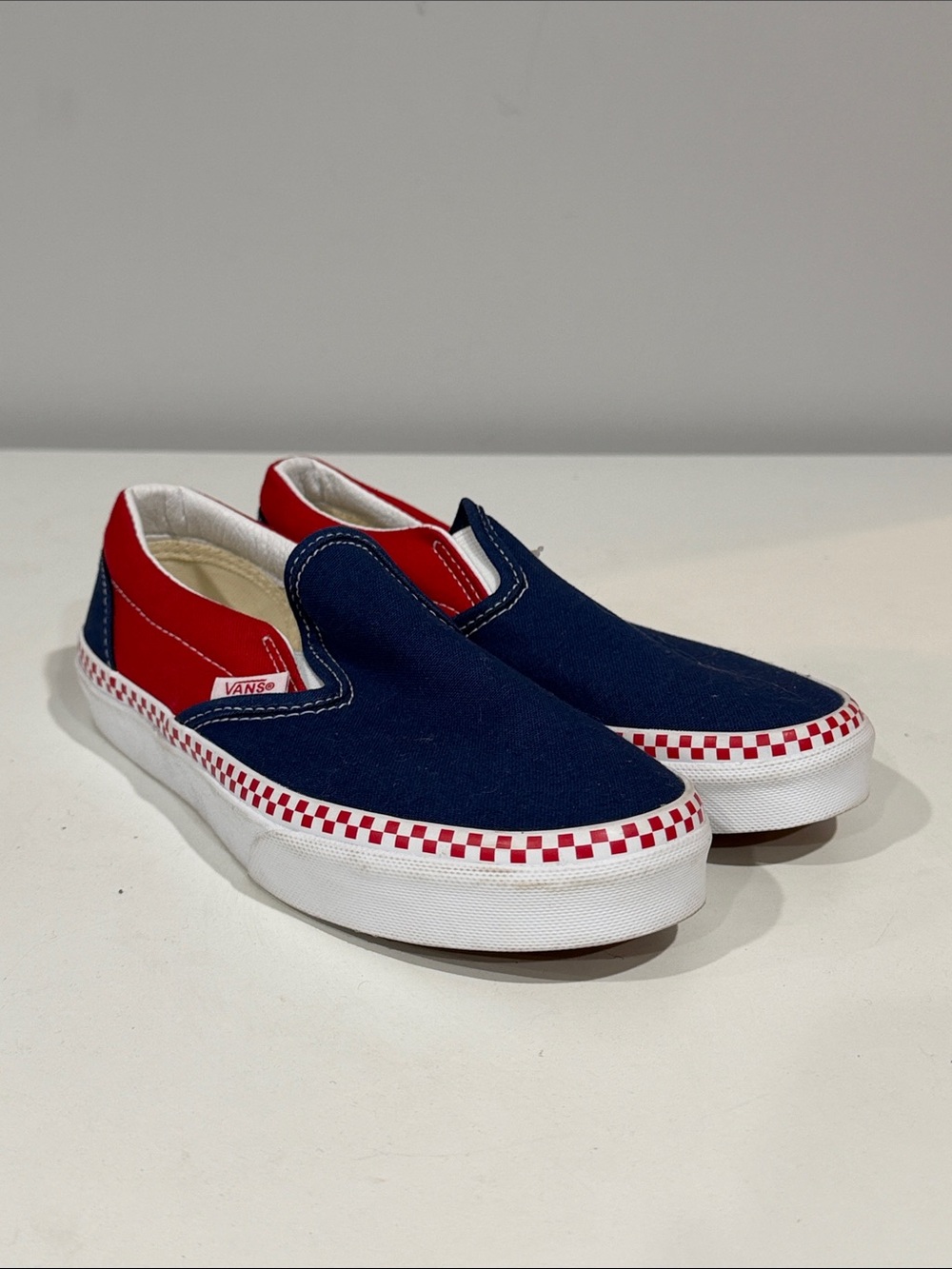 Vans Slip-On Canvas Sneakers in Navy & Red with Checkerboard Trim